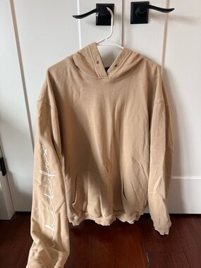 White Fox Boutique Tan Pullover Hoodie with Sleeve Script